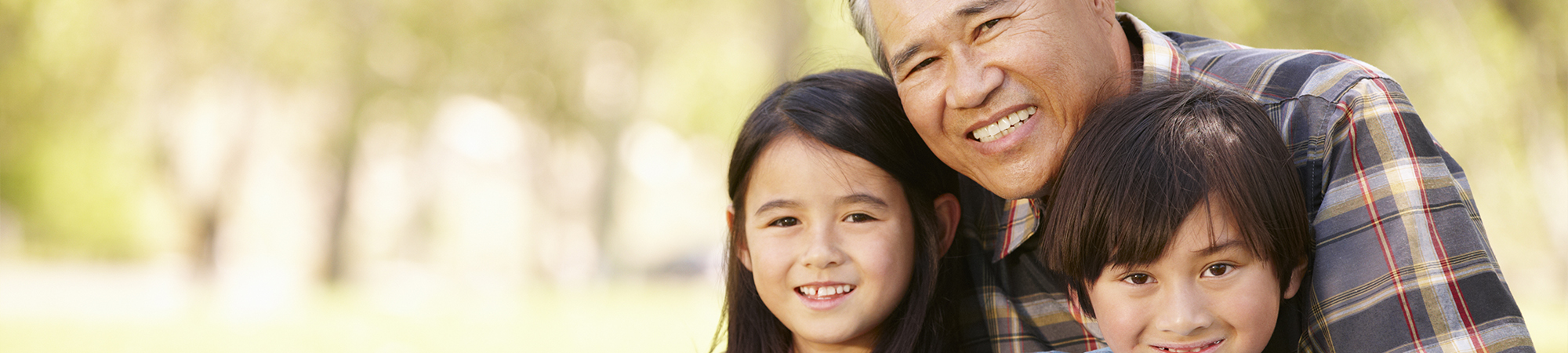 An elderly man smiles warmly